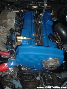 The valve covers, front engine cover and thermostat housing have been powder coated bengal blue.