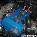 The arrows show the new valve cover venting system.  I am adding a rear oil drain to the head and these small hard lines T together and then connect to a traditional oil catch can.