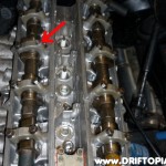 day26b The offender is the cam cap bolt. These snap very easily as they are only supposed to see 8.5 ft-lbs torque. This is how I learned my torque wrench was out of spec.