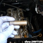 day26c Using a grinder, you have to taper the end of a deep 13mm socket in order to reach the head bolts.