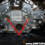 day26e The two plugs that need to be removed from the back of the head to add the rear oil drain.