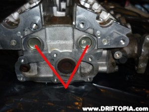 The two plugs that need to be removed from the back of the head to add the rear oil drain.