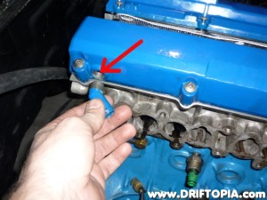 Removing the original return from the intake side valve cover.