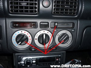Pull the indicated knobs off of the panel.