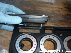 This image shows the general idea behind mounting the gauge.  Small bolts will be placed through the back of the ScanGaugeII panel and then through the dash panel.