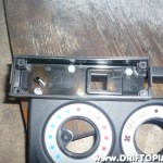 I ended up using three holes with small bolts to connect the back of the ScangaugeII to the dash panel.