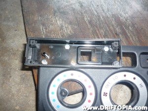 I ended up using three holes with small bolts to connect the back of the ScangaugeII to the dash panel.
