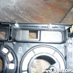 The bolts are then secured with nuts on the back side of the dash panel.  The back of the ScanGaugeII is now firmly attached to the panel.