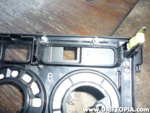 The bolts are then secured with nuts on the back side of the dash panel.  The back of the ScanGaugeII is now firmly attached to the panel.