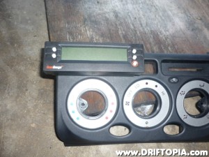 Once the back of the ScangaugeII and the dash panel are attached, reinstall the circuit board and front plate of the gauge.  There will be just enough room to tighten the 4 screws with a small electronics screwdriver.