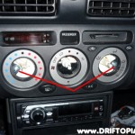 Remove the indicated screws and then pull the panel out of the dash.
