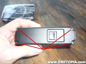 Flip the ScanGaugeII over and remove the 4 screws that hold the housing together.
