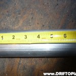 Measuring the exhaust tube before cutting.