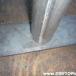 Place the end of the pipe on the steel plate,