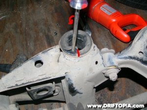 The cut along the edge of the bushing sleeve.