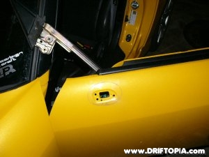 Once disconnected, the window rail can be moved around to make removing the factory mirrors from the honda s2000 a breeze.