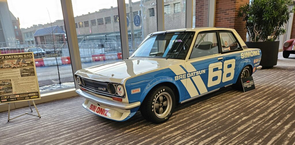 Datsun 510 racecar on the main hall at PRI 2023