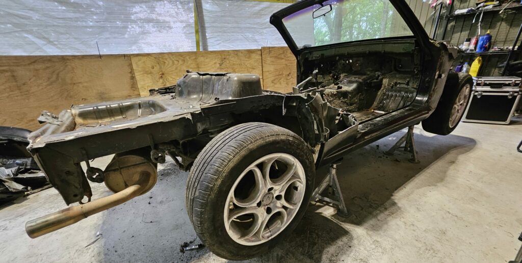 The aftermath of cutting the rear quarters and arches out of the miata. Shaping up to be a super light exo car.