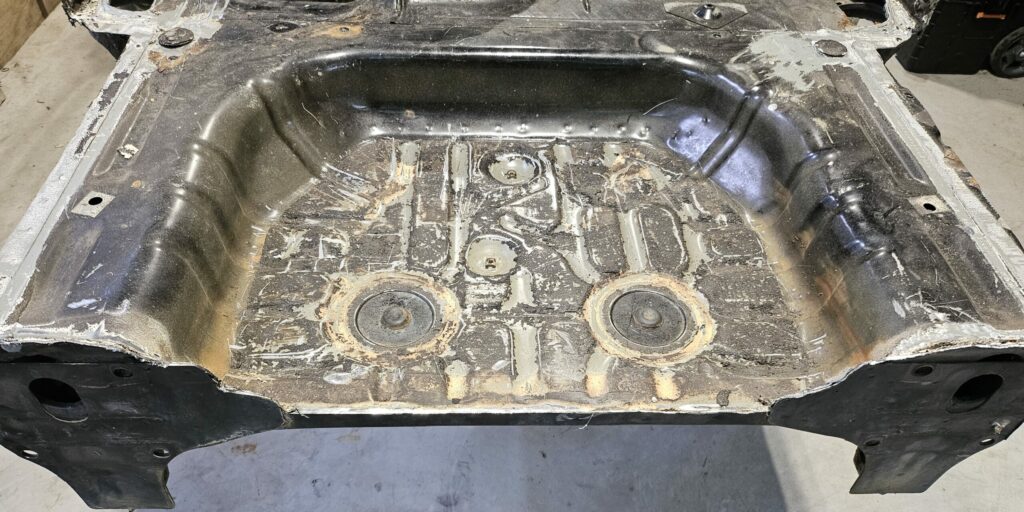 Cleanup of the rear wheel well on the NA Miata MX-5 Exo Car.