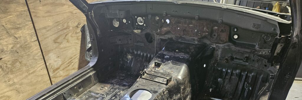 Rust on the firewall of the NA Miata Exo Car.