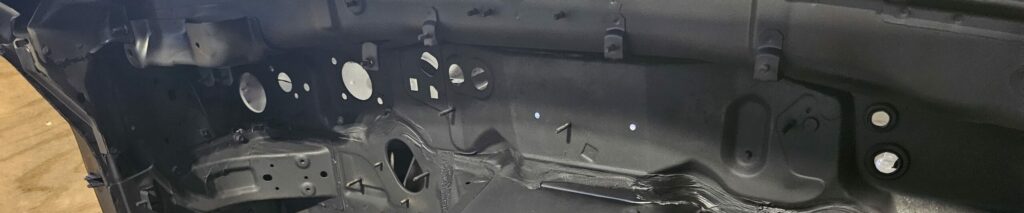 The firewall after the rust removal and coating with rust neutralizer.