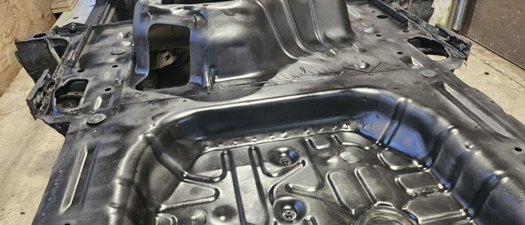 Rust neutralizer sprayed on the NA Miata chassis.