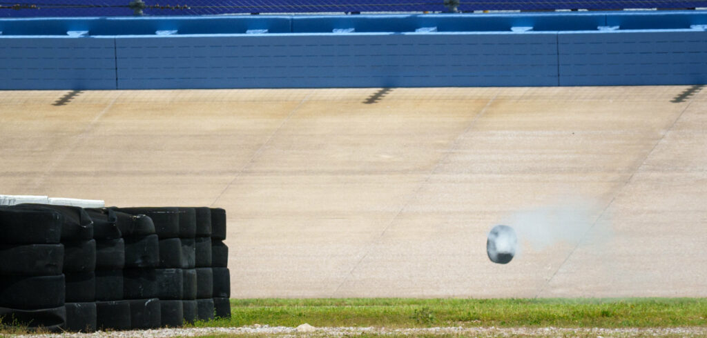 Wheel from the damaged 944 Spec making it's way down the track.