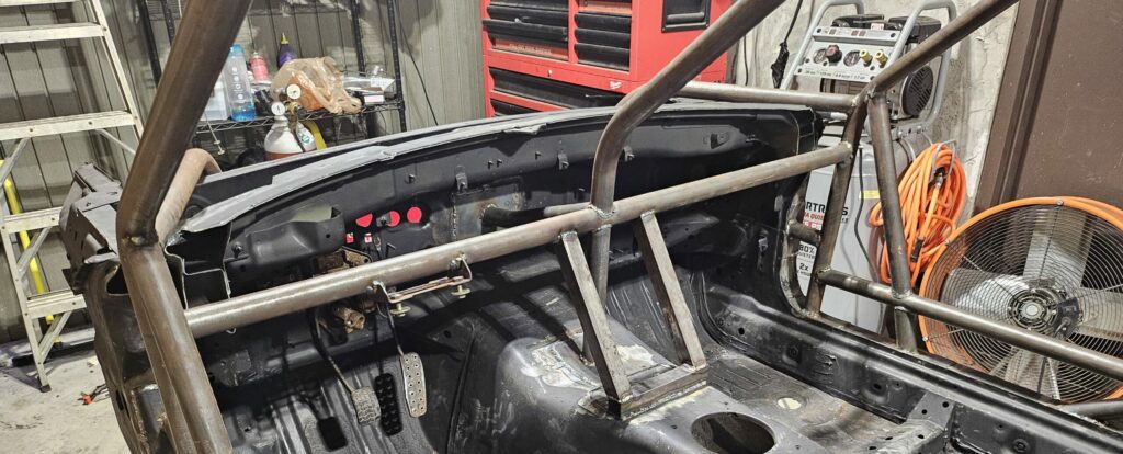 The lower dash bar of the ghettocet miata's roll cage.