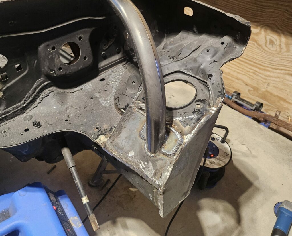 The front end reinforcement plates on the 1991 NA Miata front end.