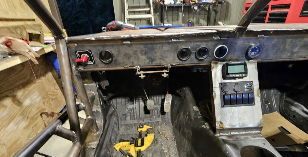 The finished dash and switch panel on the ghettocet miata.