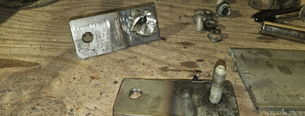 The bolt welded to the sway bar bracket for the Miata ghettocet.