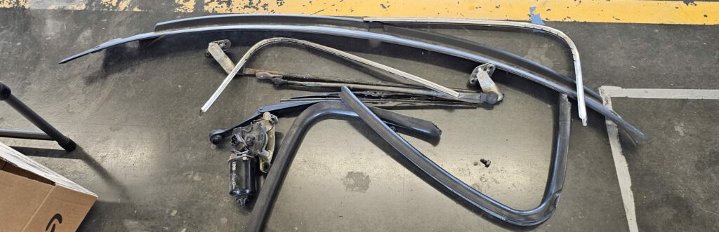 The take off pile during the extreme weight reduction of the na super touring 6 miata.