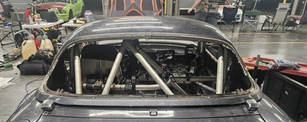 The NA Super Touring 6 Miata with the rear hatch glass removed.