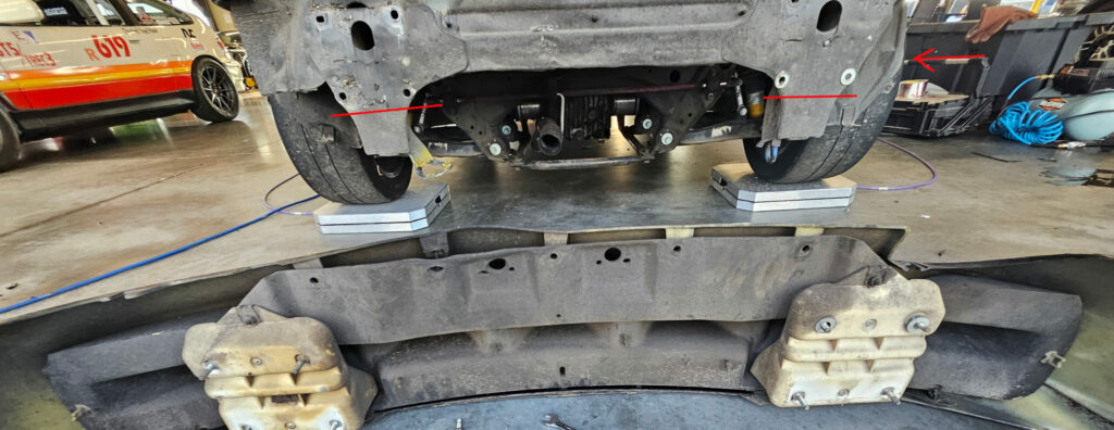 Marked areas to cut the bumper during the weight reduction process on the Miata.