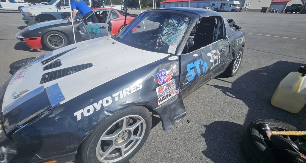 The damaged ST6 Miata after hitting the tire wall at the national Corvette Museum.