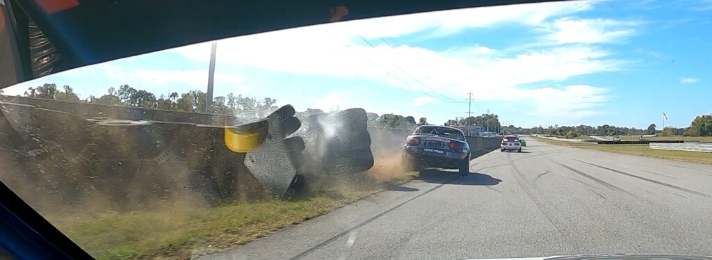Hitting the tire wall at the national Corvette Museum in the Super Touring 6 Miata,