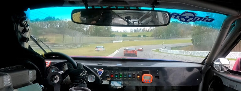 In car view of the 4 way battle for 1st place in 944 Spec at Barber Motorsports Park.