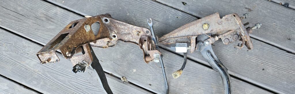 The pedals of the na miata exo car ghettocet before cleaning and paint.