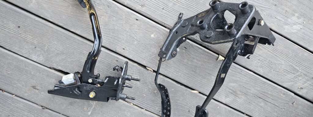 Thge cleaned and painted pedals of the na miata exo car ghettocet.