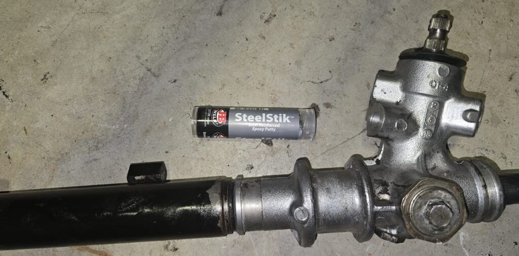 JB Weld used to seal the hydraulic holes in the NA Miata steering rack.
