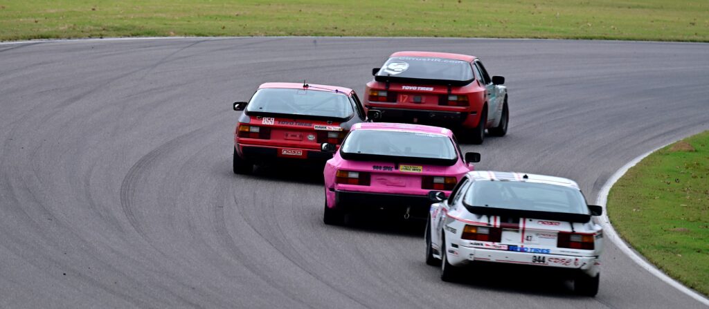 944 Spec racecars running nose to tail at Barber Motorsports Park