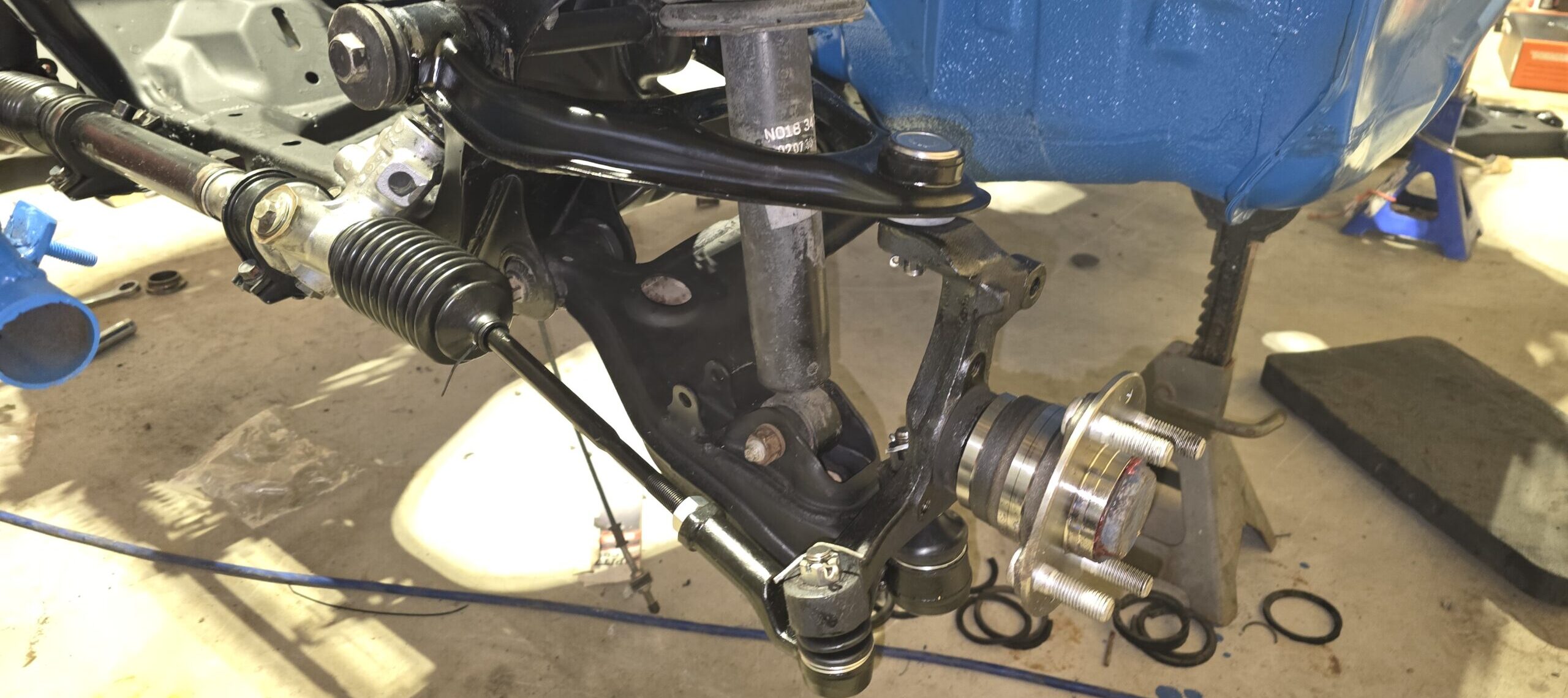 The front suspension refreshed on the na miata ghettocet.