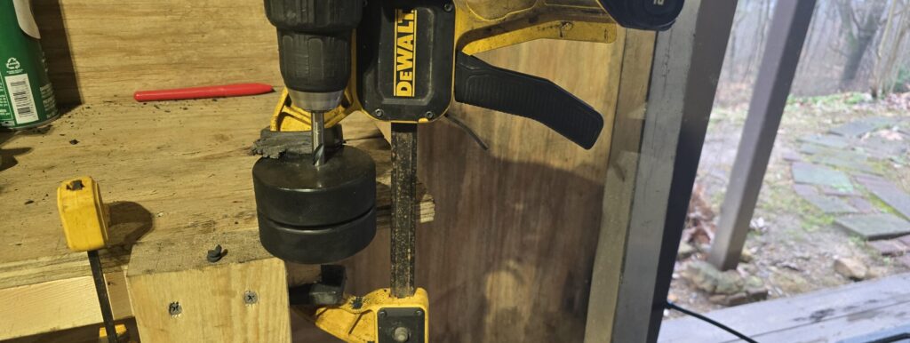 Drilling hockey puck motor mounts for the NA Miata Ghettocet.