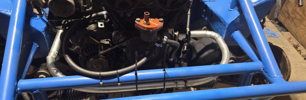 Alternate view of the cold side pipe for the rear mount radiator in the Miata.