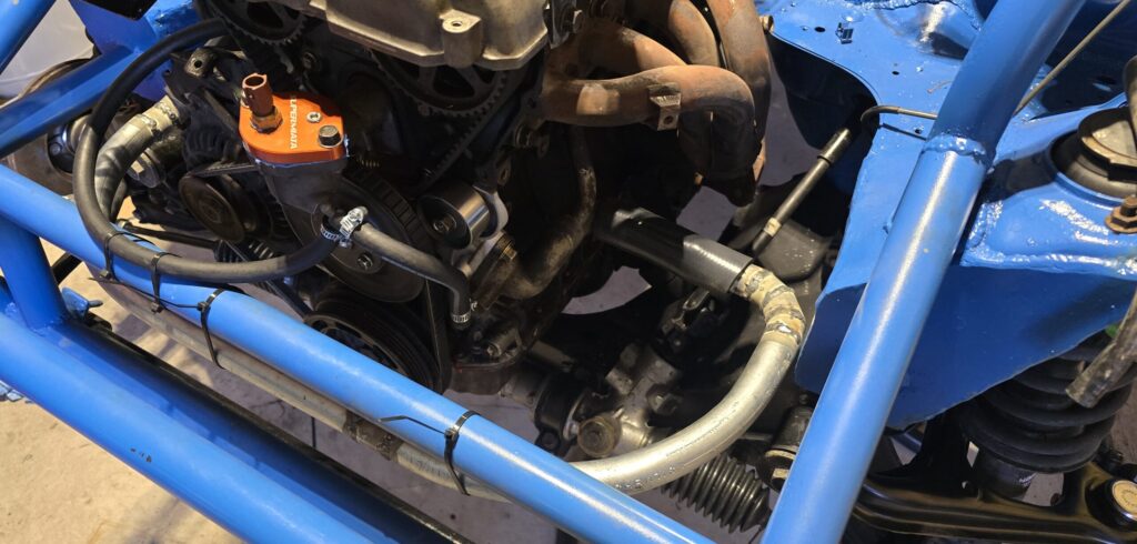 Engine cold side line on the rear mount radiator for the miata.