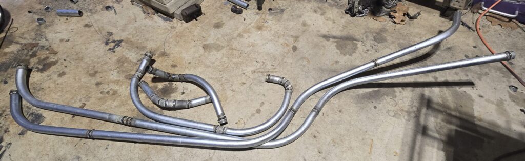 Coolant hardlines pictured together for the rear mount radiator on the miata.