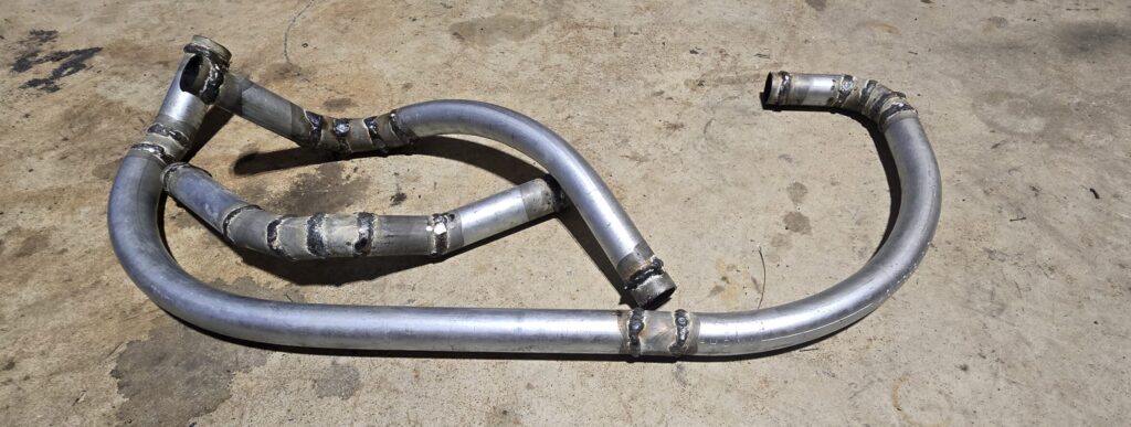 The engine side coolant hardlines when moving the miata radiator to the rear of the car.