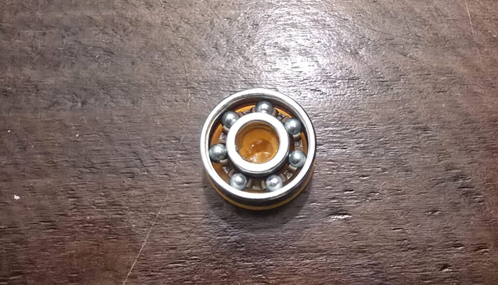 The inner bearing race glued to the fidget spinner cover.