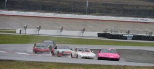 The pink 944 spec leading the pack at Nashville Superspeedway.