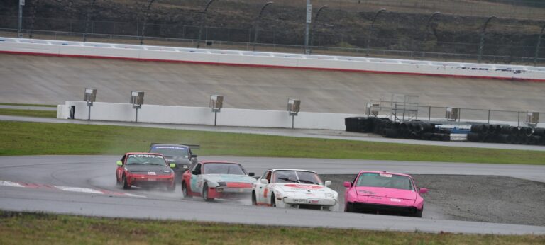 The pink 944 spec leading the pack at Nashville Superspeedway.
